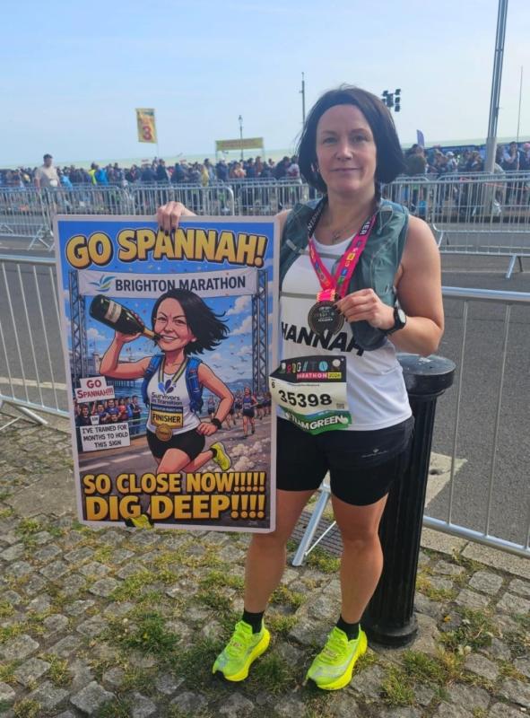 hannah with medal and poster.jpg